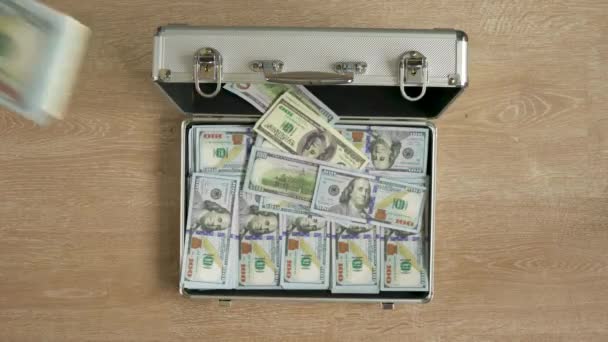 Money falls in a suitcase and it closes — Stock Video