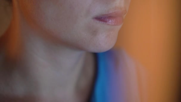 Woman in glasses looking on the monitor and surfing Internet. The monitor screen is reflected in the glasses — Stock Video