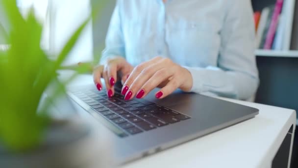Female hands with bright manicure typing on a laptop keyboard — Stock Video