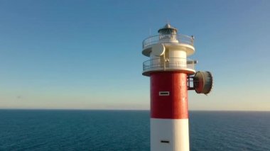View from the height on the lighthouse closeup. Ocean on the background. Lighthouse Faro de Rasca, Tenerife, Canary Islands, Spain.