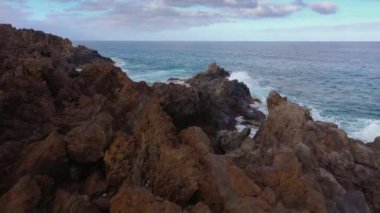 Flying over the rocky coast of Tenerife and the Atlantic Ocean, Canary Islands, Spain