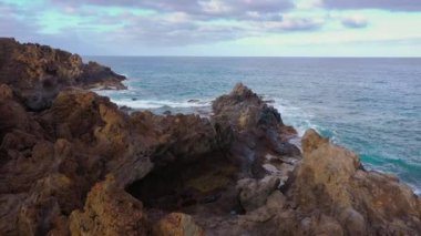 Flying over the rocky coast of Tenerife and the Atlantic Ocean, Canary Islands, Spain