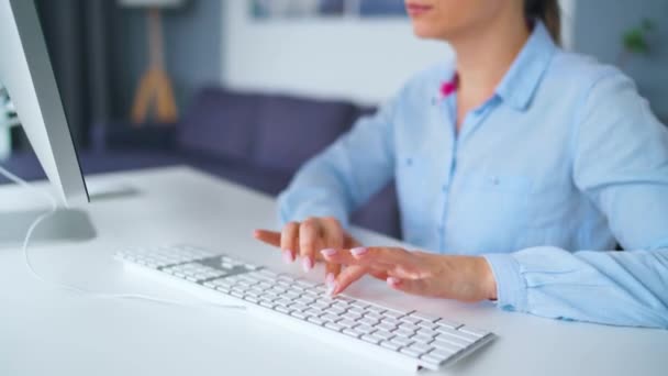 Woman typing on a computer keyboard. Concept of remote work. — Stock Video