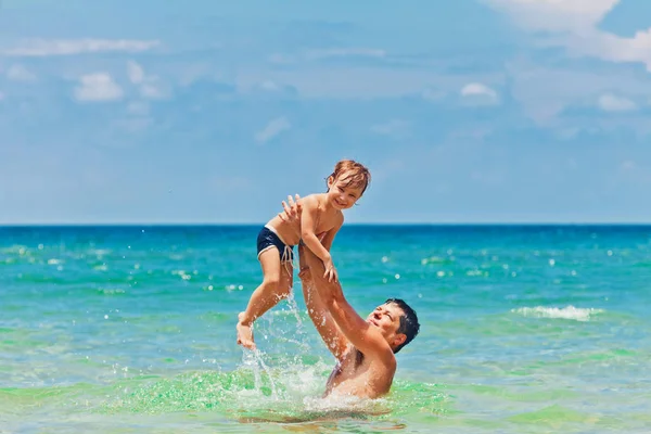 Father and son in the sea — Stock Photo, Image