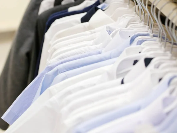 Hanger with shirts in a store — Stock Photo, Image