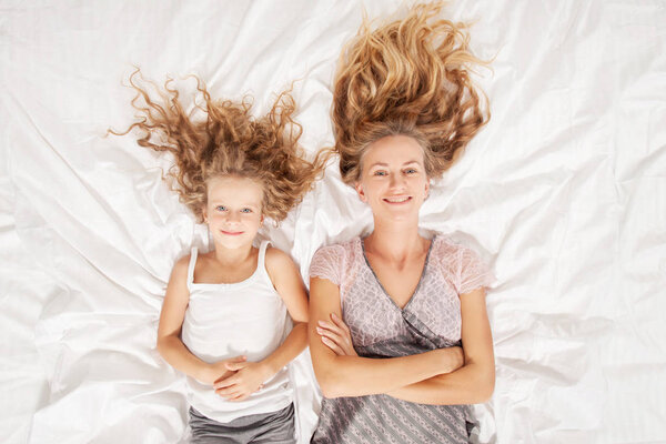 Mother with child in bedroom