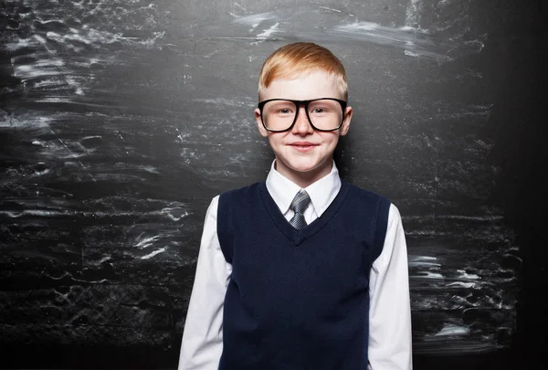 Boy near blackboard — Stock Photo, Image