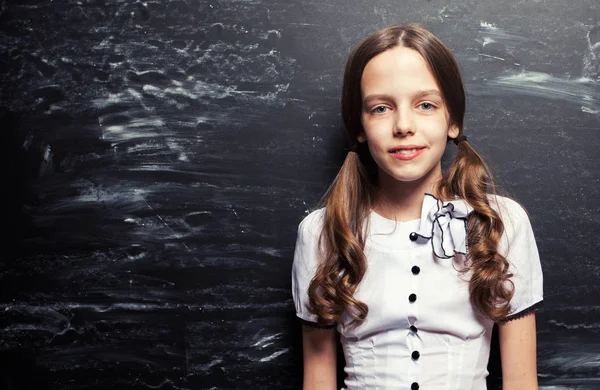 Girl near blackboard — Stock Photo, Image