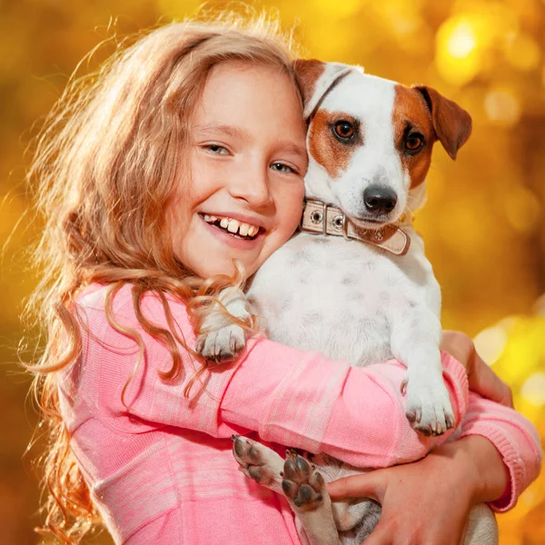 Child with dog at autumn — Stock Photo, Image