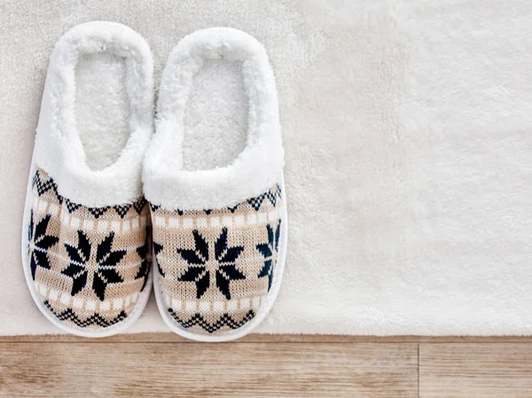 Slippers on wooden floor