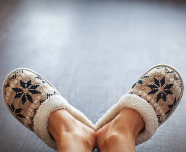 Slippers on women\'s legs