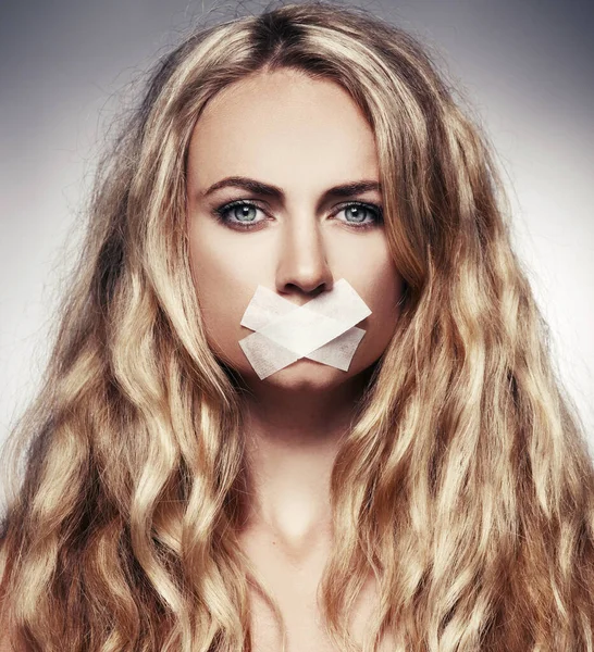 Woman with mouth sealed — Stock Photo, Image