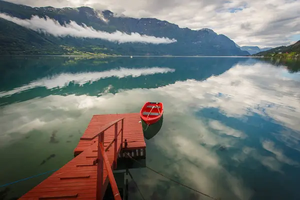 Red boat with reflection in Norway — Stock Photo, Image