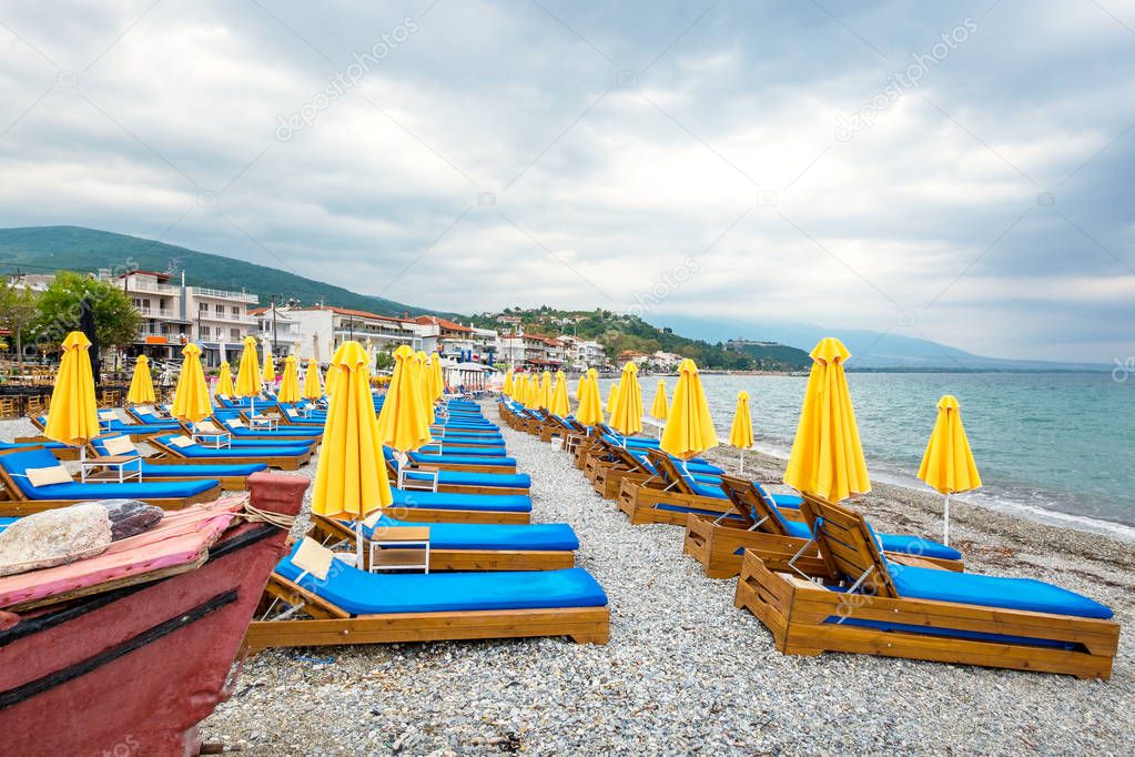 Empty beach chairs and umbrellas. Platamonas, Pieria, Greece