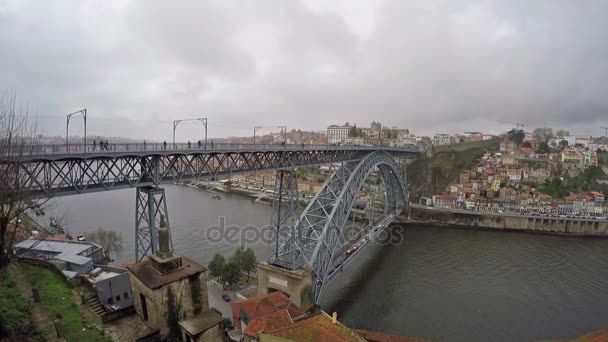 March 06, 2017 - Panoramic view of the City of Porto in Portugal. Traditional Portuguese boats on Douro river, famous Dom Luis I bridge and Ribeira district — Stock Video