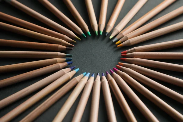 Many different colored pencils on black background — Stock Photo, Image