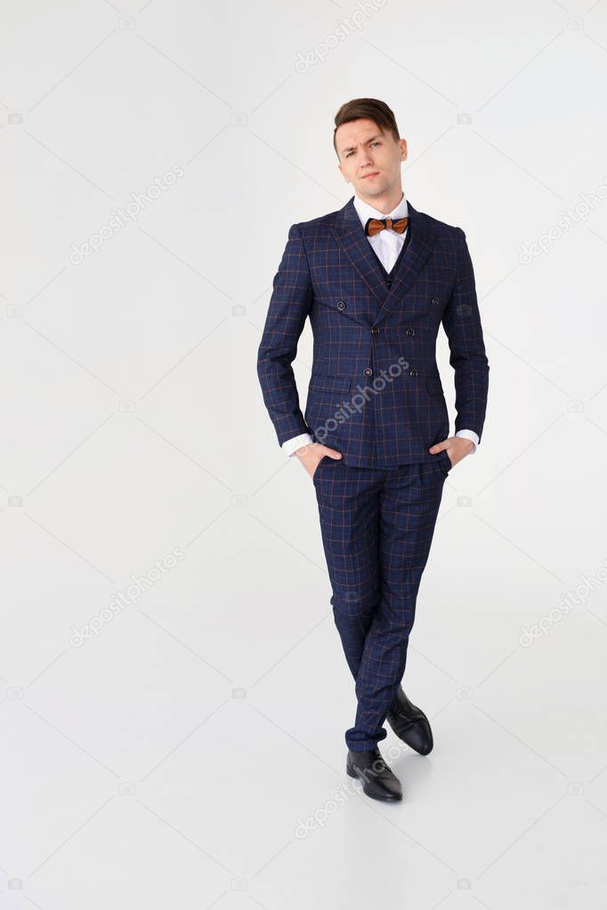Confident handsome businessman on white background