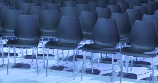 Large Empty conference hall with rows of seats for spectators and audience. — Stock Video