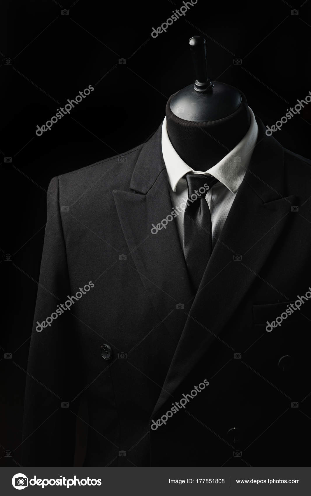 Detail of a clothing mannequin in a men suit shop with a white