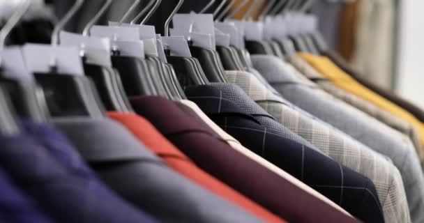 Man is shopping choosing office suit in clothing manswear store, hands closeup. — Stock Video