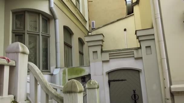 Two little beautiful girls walk in Riga, Latvia. Riga is largest city of Baltic states and home to one third of Latvia's population. City lies on Gulf of Riga, at mouth of Daugava. — Stock Video