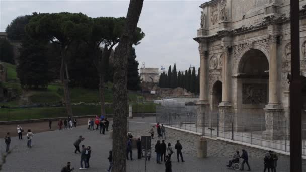Arch of Constantine is a triumphal arch in Rome, situated between Colosseum and Palatine Hill. Erected by Roman Senate to commemorate Constantine I victory over Maxentius at Battle of Milvian Bridge. — Stock Video