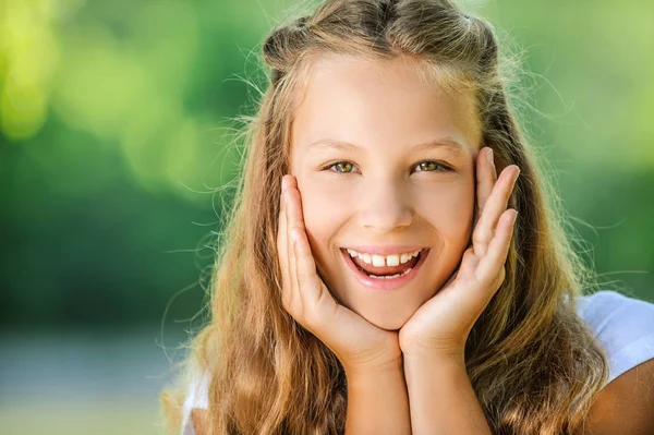 Smiling teenage girl in white blouse — Stock Photo, Image