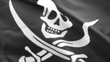 Jolly Roger hakkında saldırmak için korsan gemisi tanımlamak için uçakla bayrakları geleneksel İngiliz adıdır. Siyah bayrak, kafatası ve kemiklerin sembolü korsan kaptanları tarafından 1710s sırasında kullanıldı.