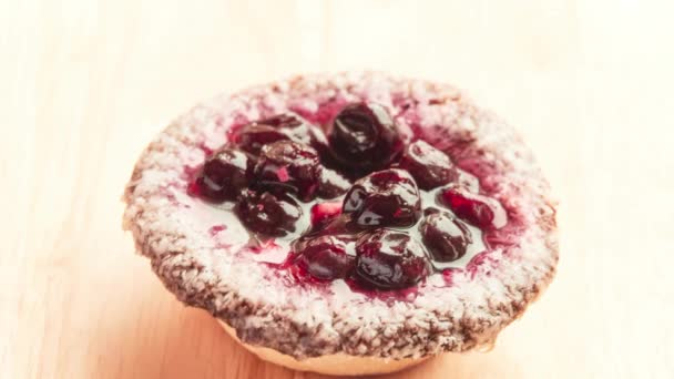 Cherry fruit tart. Tart is baked dish consisting of filling over pastry base with an open top not covered with pastry. Modern tarts are fruit-based. Tartlet refers to a miniature tart. — Stock Video