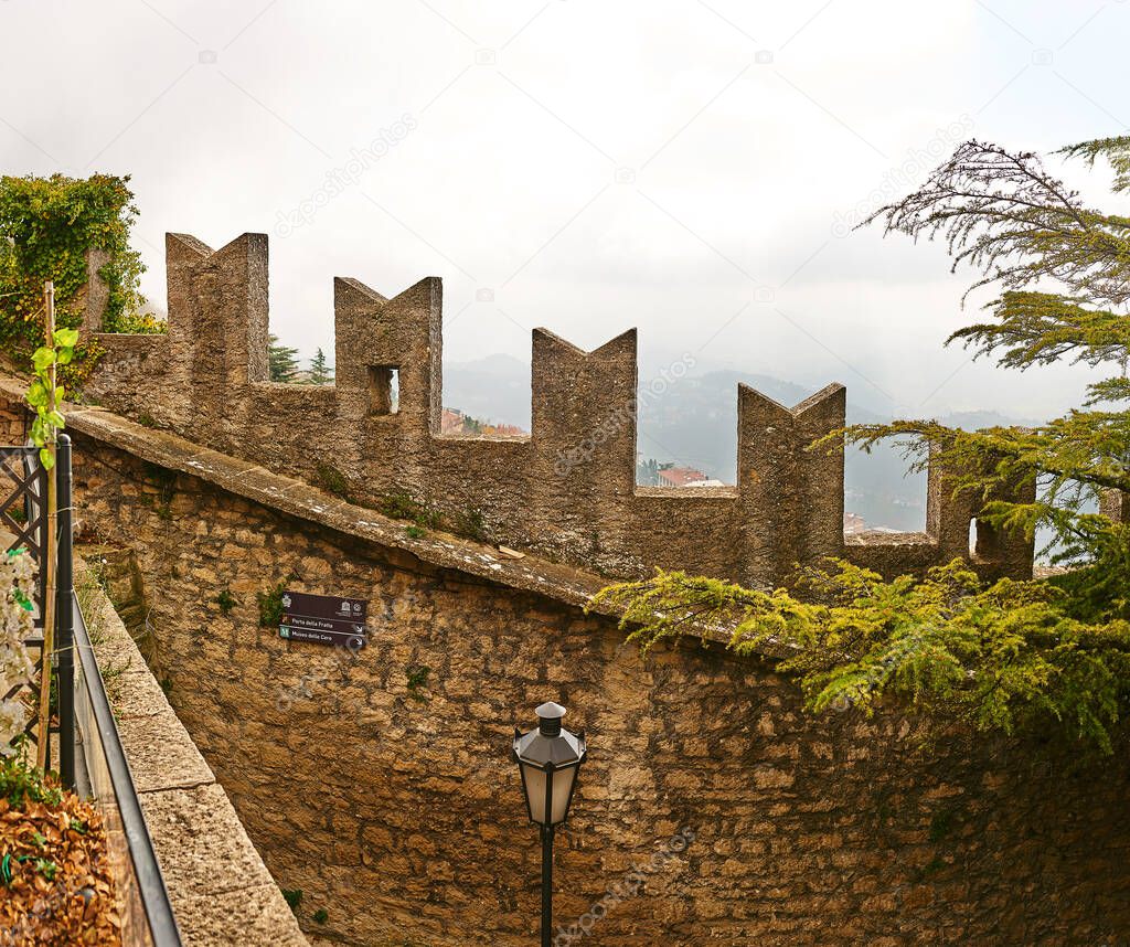 Guaita fortress is oldest of three towers constructed on Monte Titano in city of San Marino. It was built as prison. It is one of three towers depicted on both national flag and coat of arms.