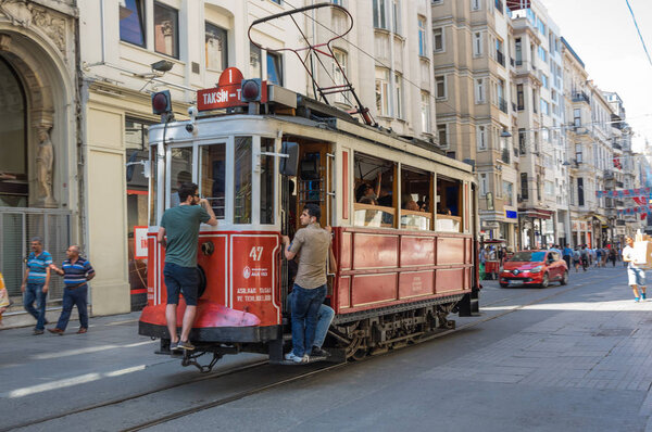 A red classic tram in Istiklal street