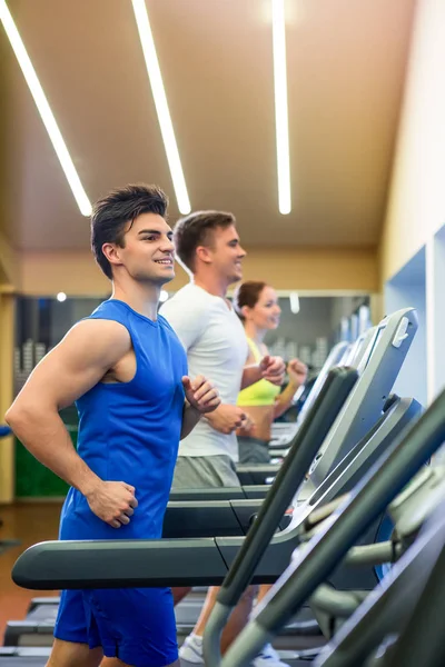 Running people on a treadmill — Stock Photo, Image