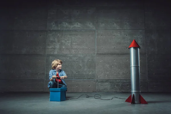 Little boy with rocket — Stock Photo, Image