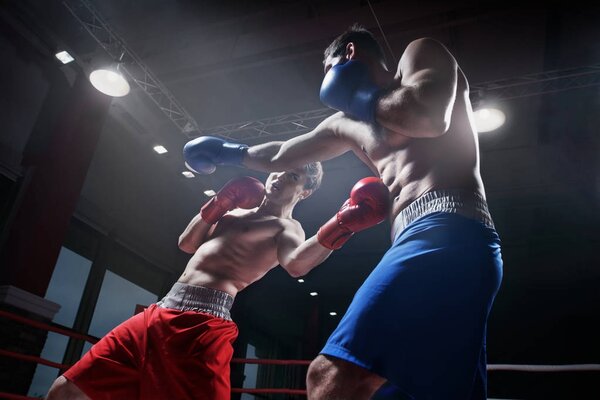 Fighting in boxing ring