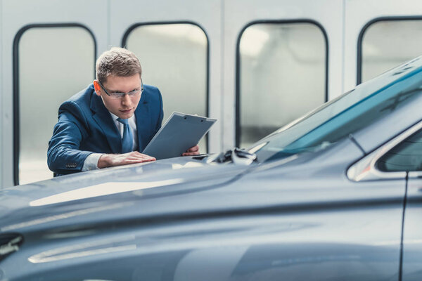 Businessman in garage