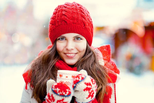 Girl with a cup of hot drink — Stock Photo, Image