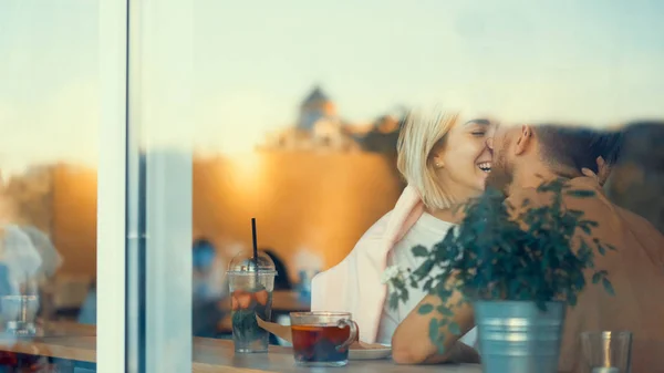 Kissing young couple indoors — Stock Photo, Image