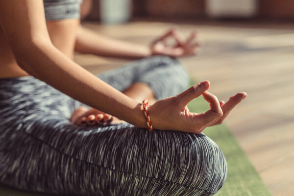 Young girl practicing mudra close-up