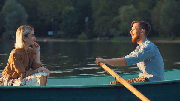Attractive couple in a boat — Stock Photo, Image