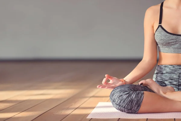 Young girl in a lotus pose — Stock Photo, Image