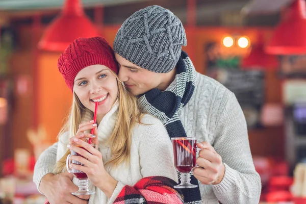 Young couple at Christmas in cafe — Stock Photo, Image