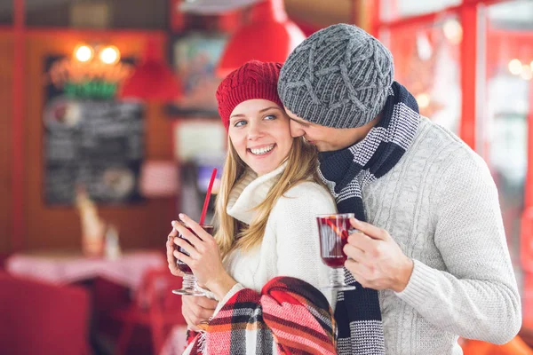 Young couple with glasses of mulled wine — Stock Photo, Image