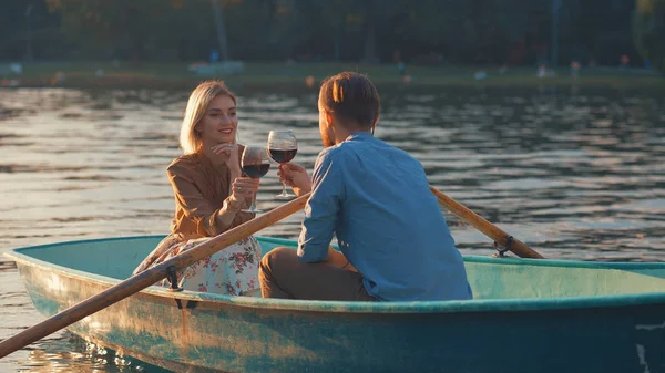 Happy young couple in a boat — Stock Photo, Image