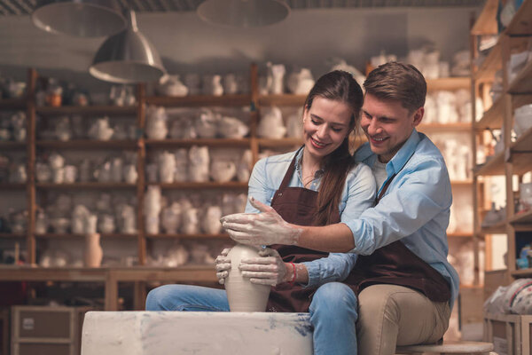 Smiling couple in pottery