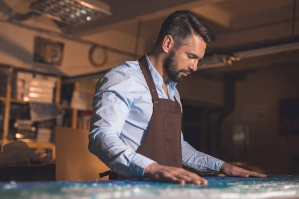 Young master in uniform at artwork — Stock Photo, Image