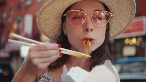 Young Woman Eating Asian Food Outdoors — Stock Video