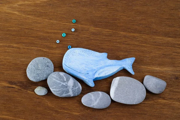 Whale made of clay on a wooden background — Stock Photo, Image