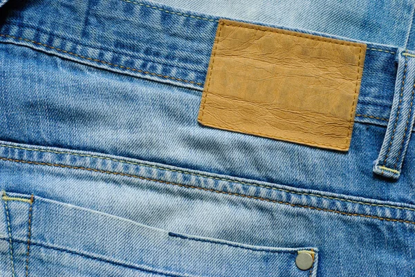Vecchio jeans blu denim wirh etichetta vuota — Foto Stock