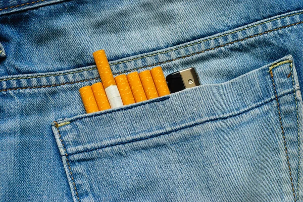Cigarettes in old jeans pocket — Stock Photo, Image