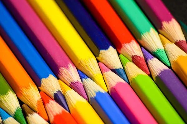Colorful pencils on a black background — Stock Photo, Image